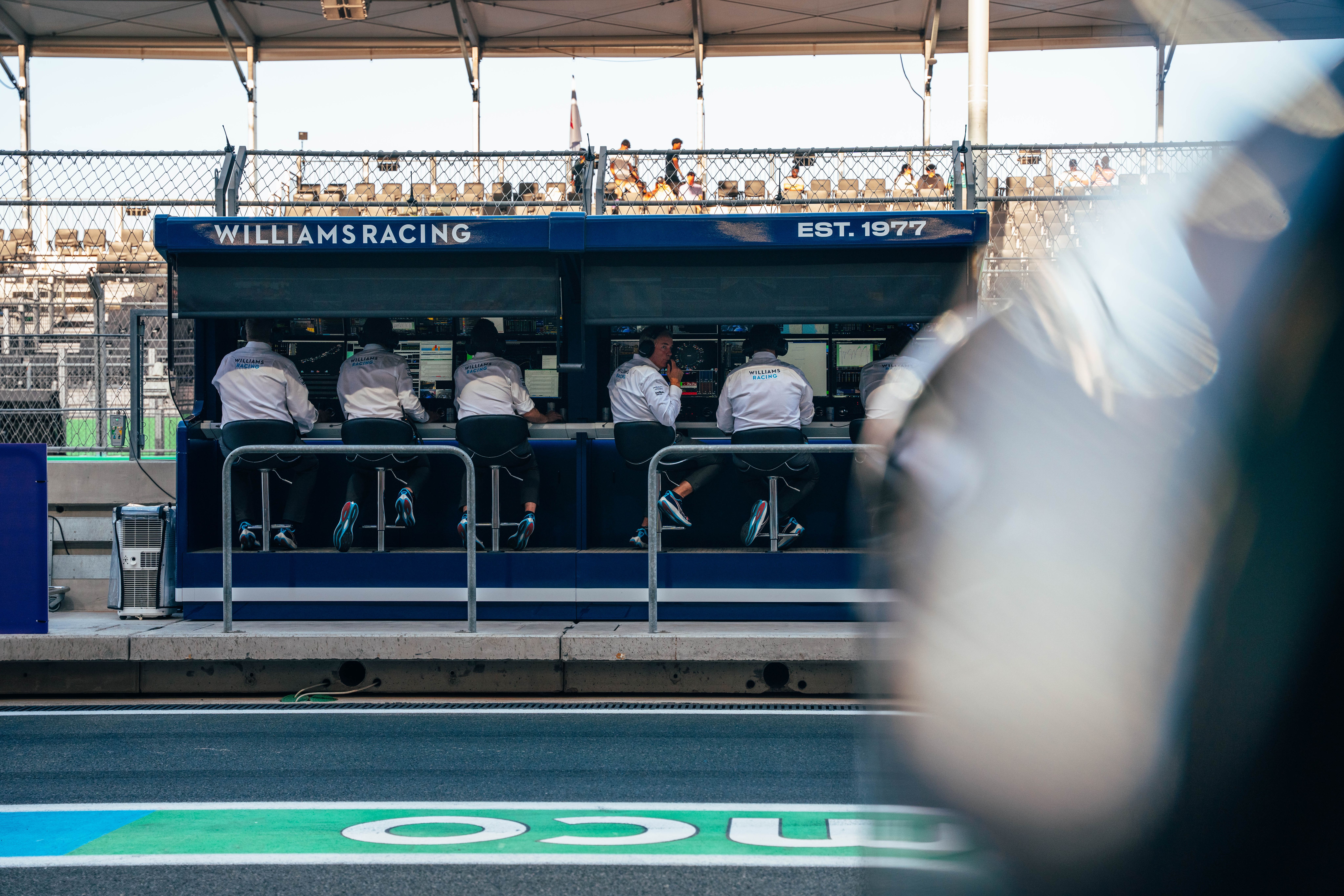 Pit wall watches on.