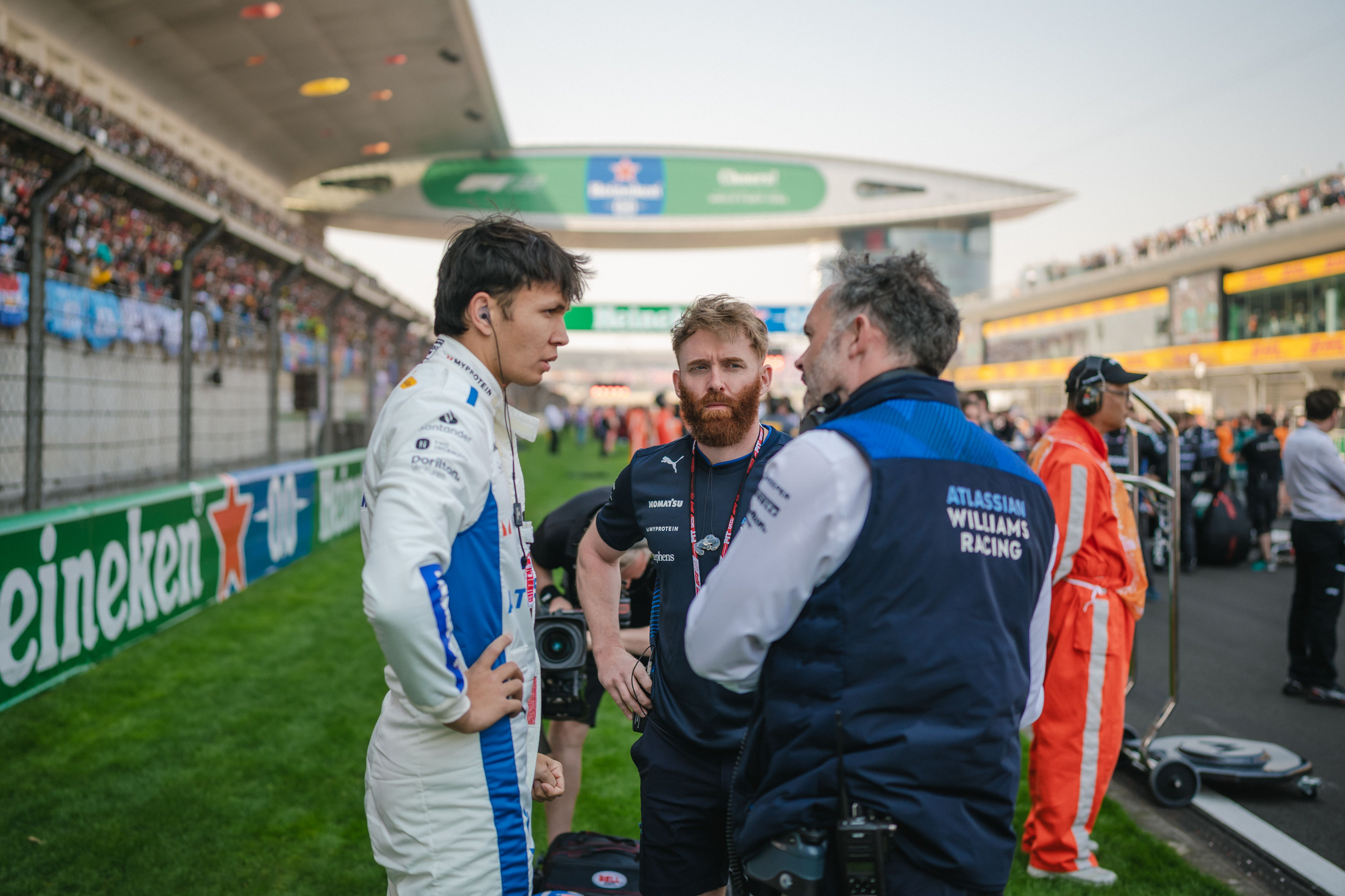 Alex, Patrick, and James chat last-minute race preparation