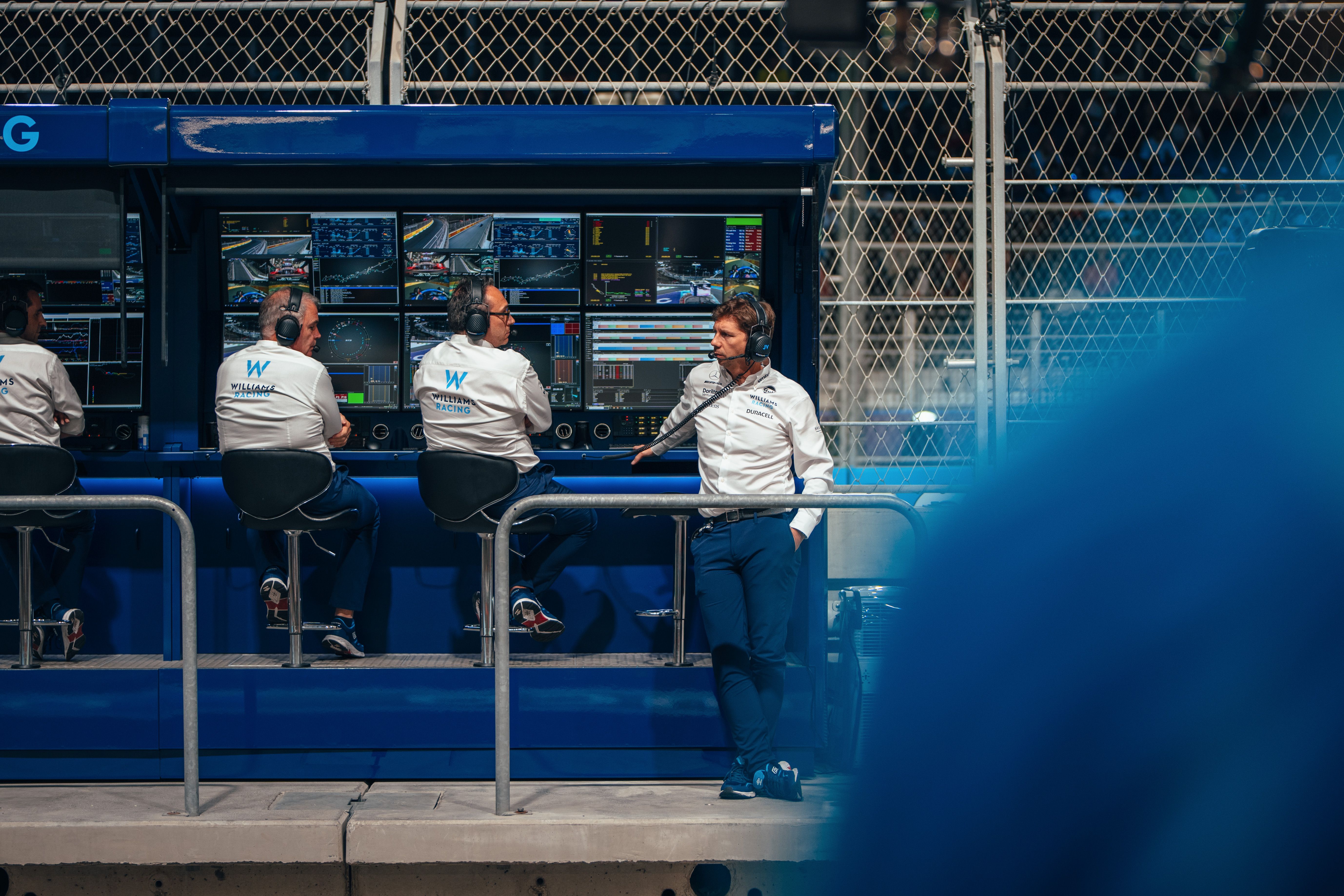 The boss watches on.