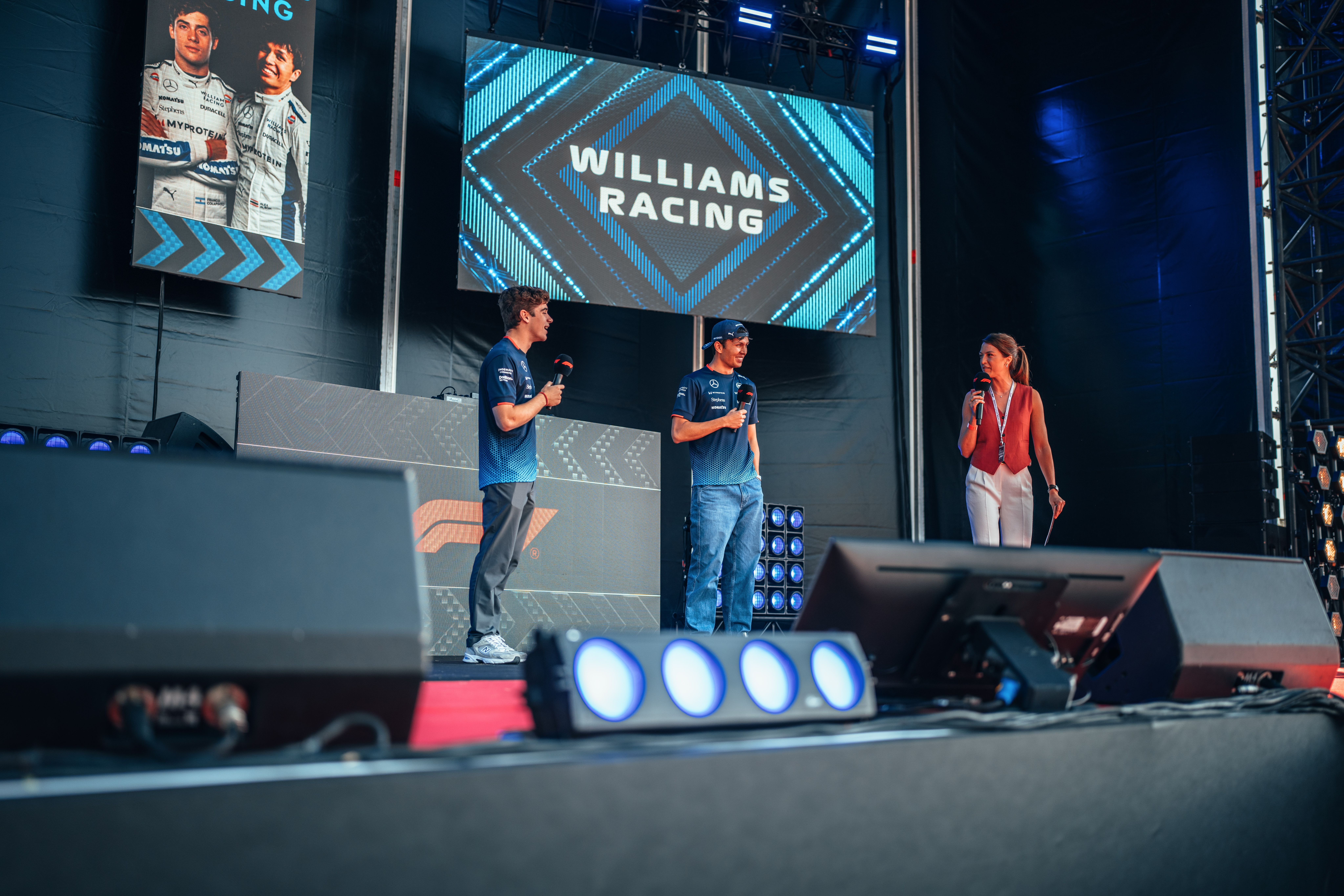 Taking to the stage.