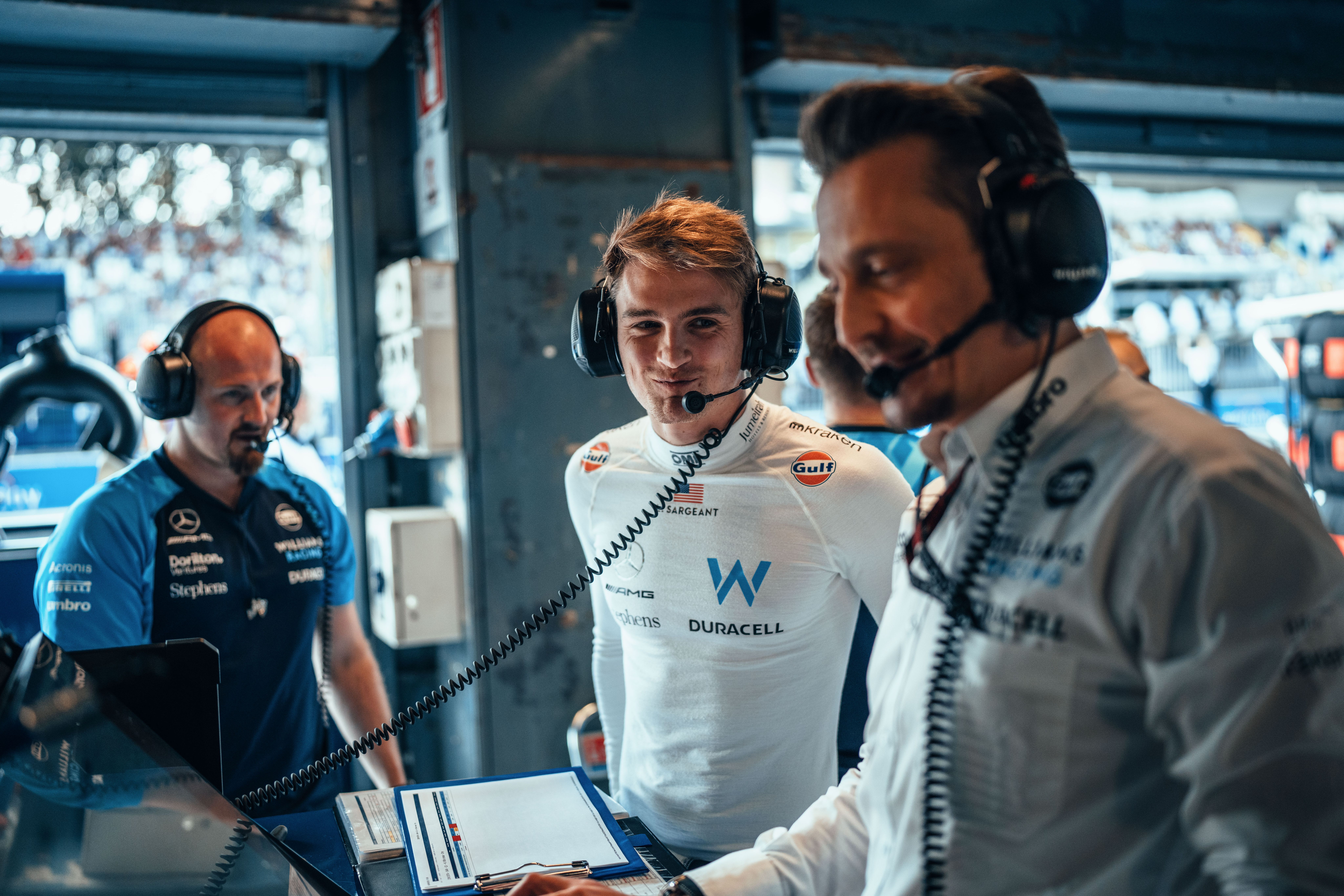 Smiles in the garage during a busy Saturday in Italy.