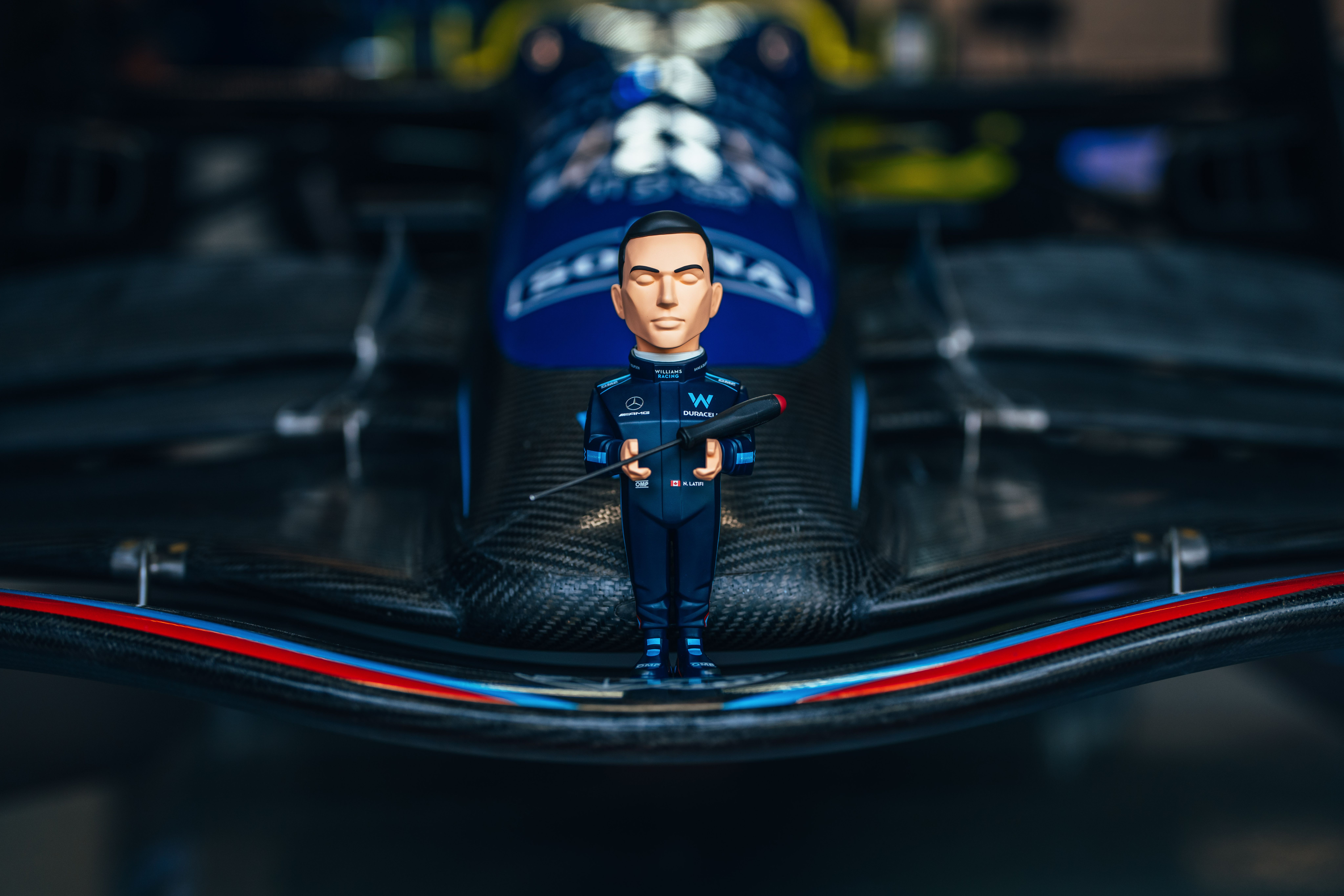 Nicky offers his mechanics a little bit of help as they prep car #6.