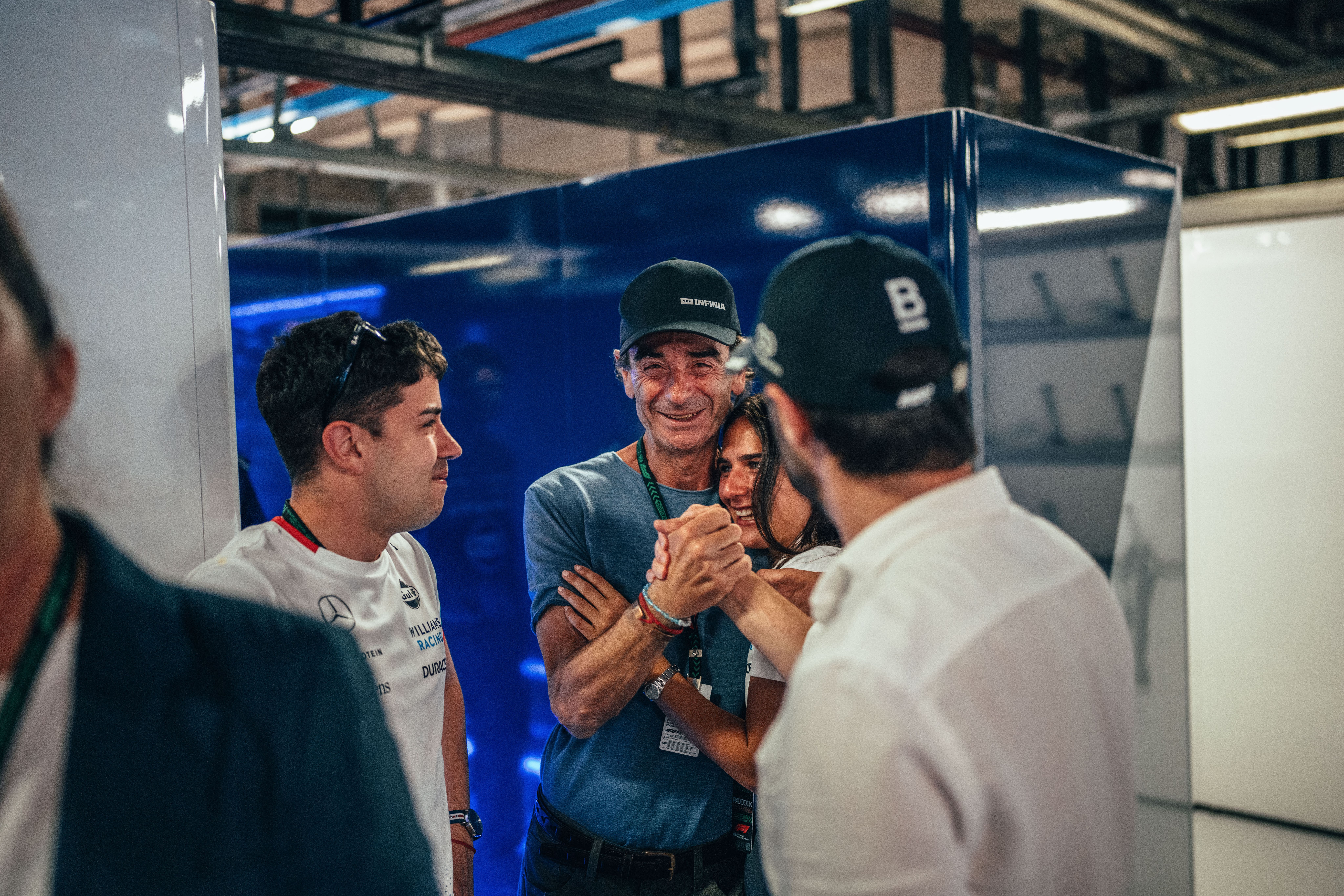 A proud father looks on