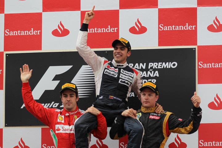 Pastor Maldonado is held aloft after his Barcelona win, one of the iconic images from the 2010s.