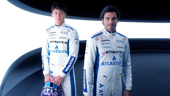 Alex Albon and Carlos Sainz in their 2025 Atlassian Williams Racing overalls.