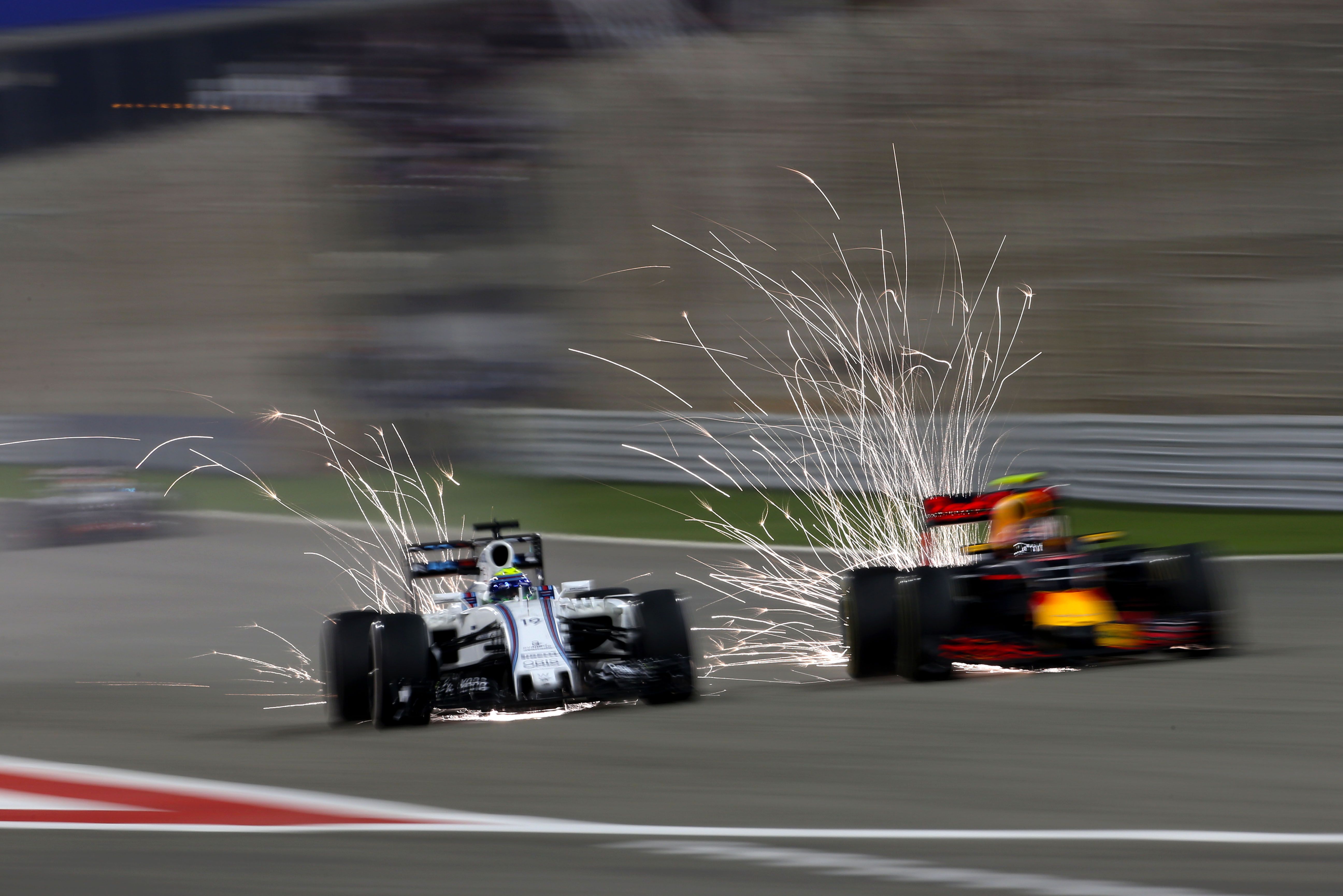 Sparks fly down the main straight in 2016 as Felipe Massa battles a Red Bull.