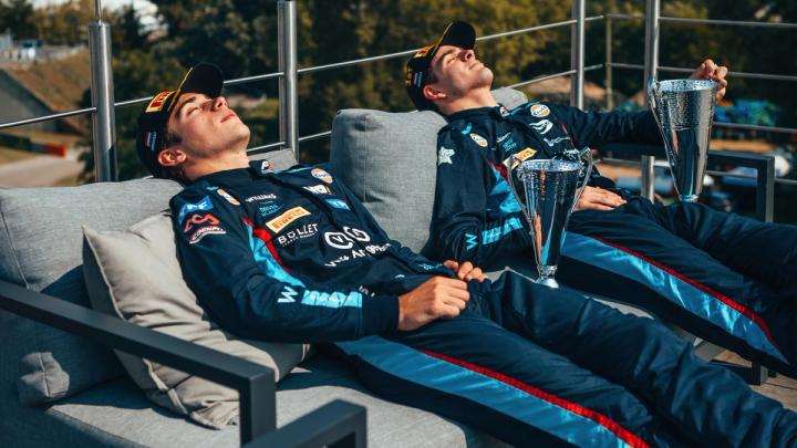 Williams Racing Driver Academy racers Franco Colapinto and Zak O'Sullivan relax with their trophies