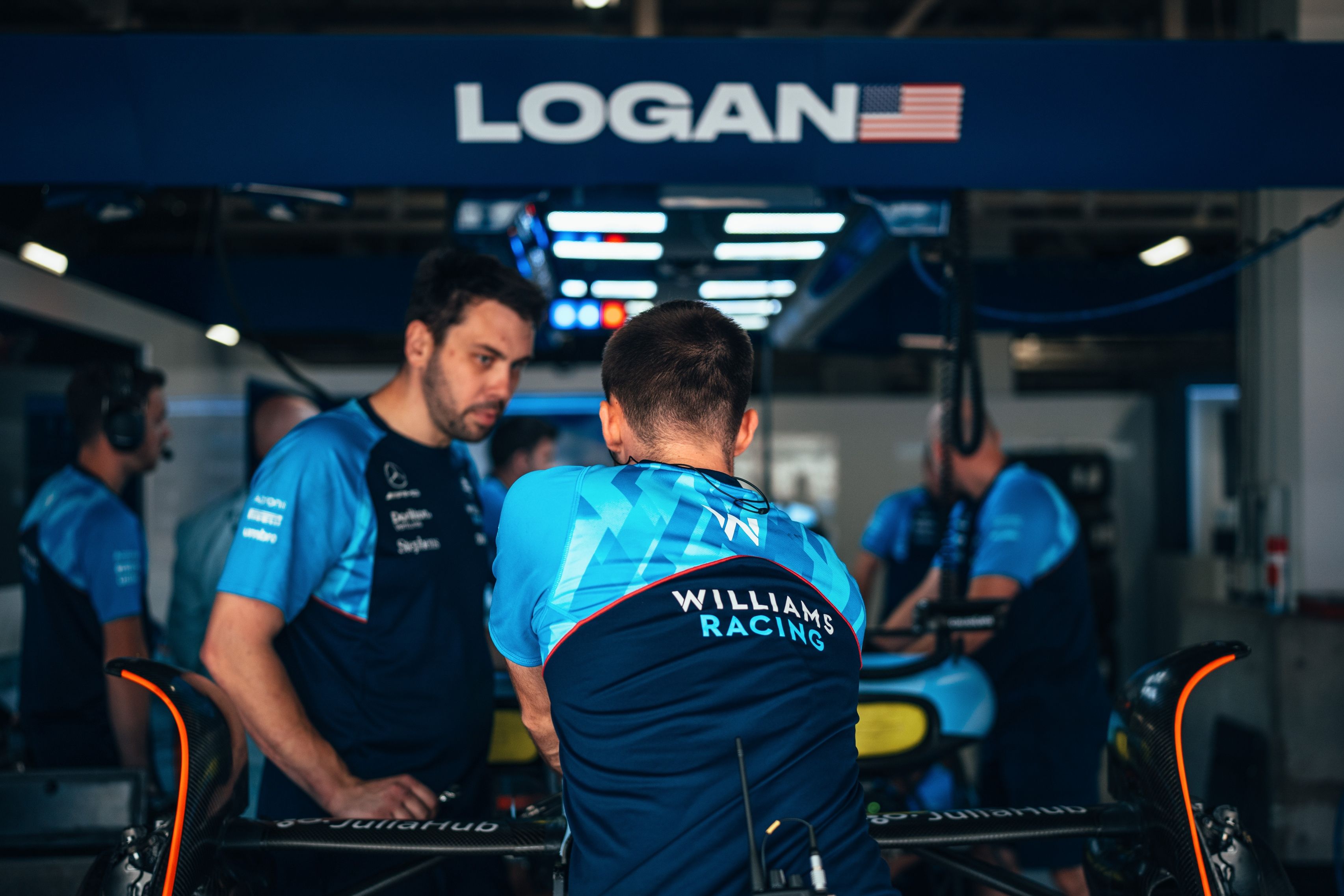 Working hard to get Logan’s car race-ready.