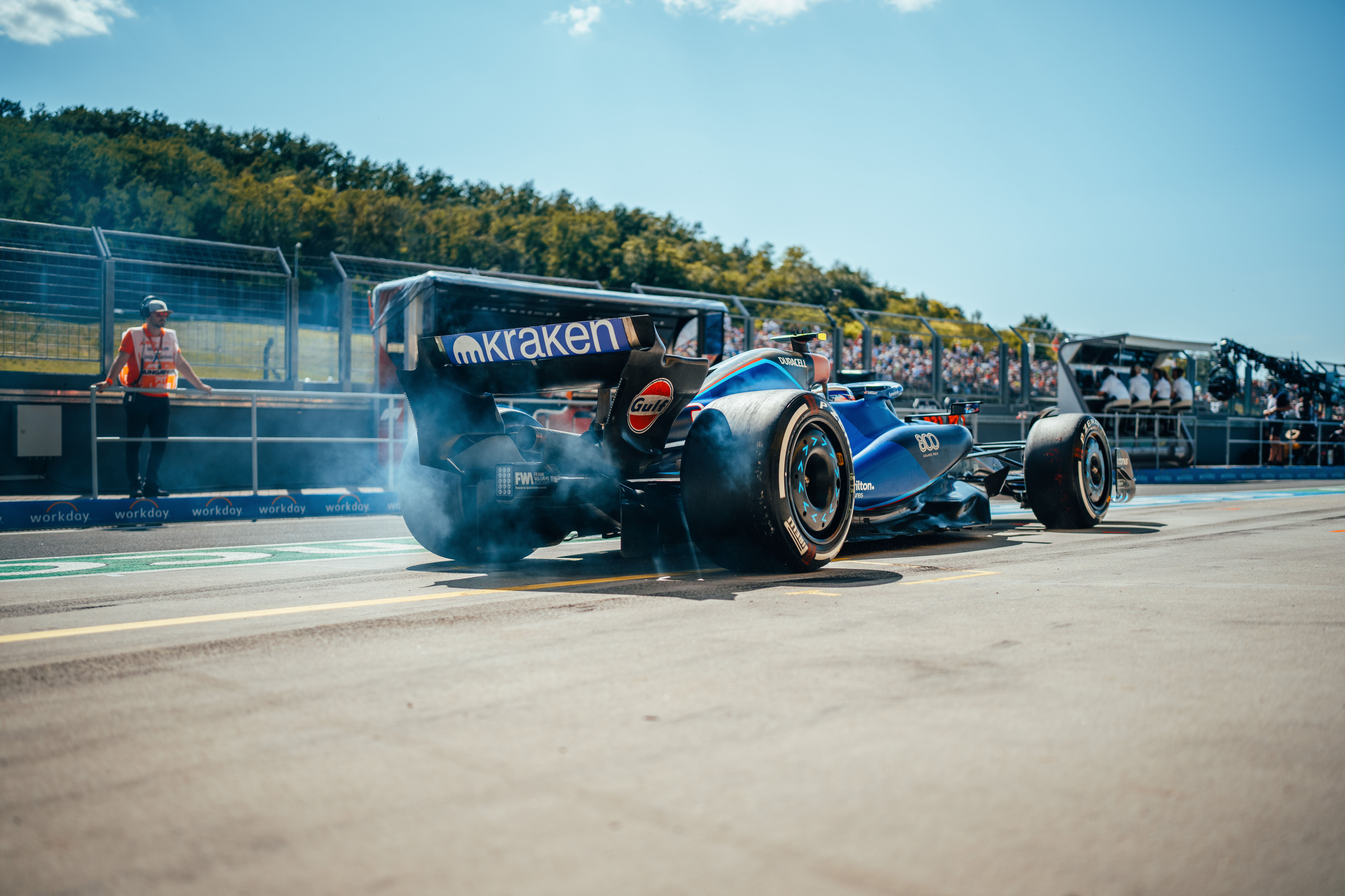 Logan lights up the rears as he stops for another set of Pirelli’s hard compound rubber.